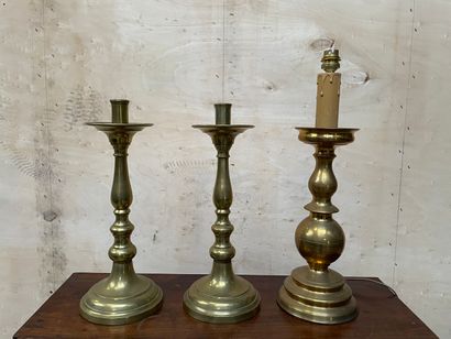 null SET including a pair of brass candle holders and a brass candle holder mounted...