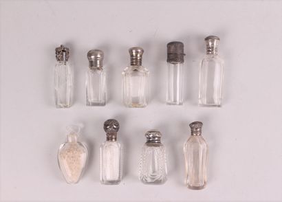 null LOT of nine small white crystal salt flasks, eight of them mounted in silver...