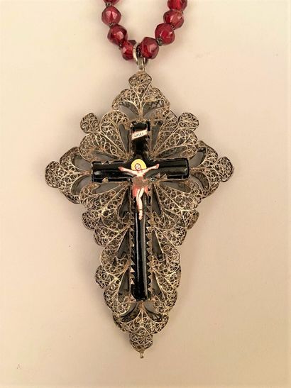 null Enamelled CROSS in a silvered metal filigree frame, held by a necklace with...