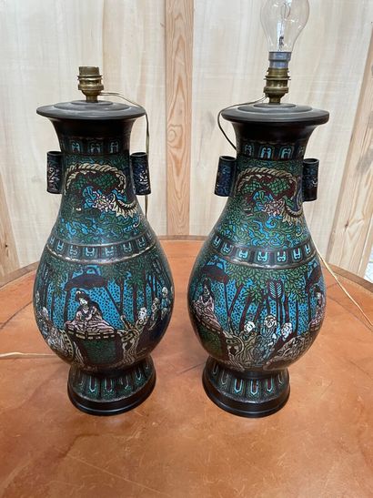 null CHINA, 19th century 

A pair of cloisonné vases decorated with characters on...
