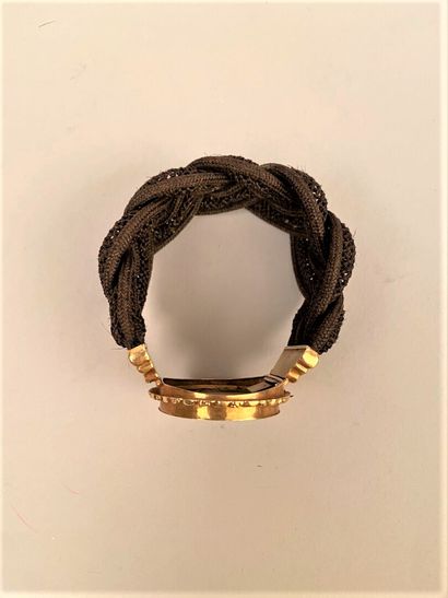 null BRACELET in braided hair, centered on an oval miniature surrounded by a yellow...
