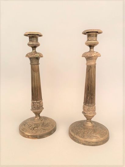 null Pair of brass corkscrews, the baluster-shaped shaft resting on a circular base...