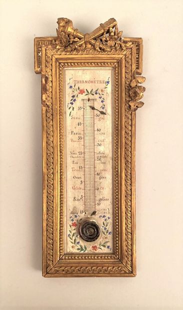 null A wood and gilded stucco mercury wall-mounted THERMOMETER, topped by a small...