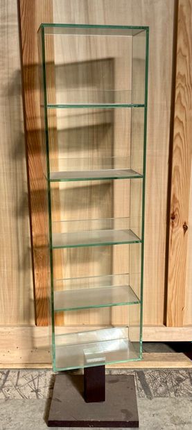 null Swivel glass bookcase with five trays, resting on a laminated wooden base. 

Height...