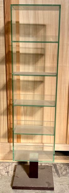 null Swivel glass bookcase with five trays, resting on a laminated wooden base. 

Height...