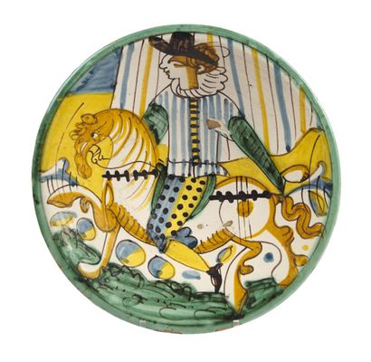 null MONTELUPO

Round majolica dish with polychrome decoration of a rider turned...