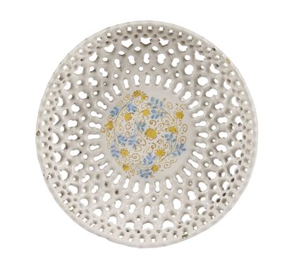 null FAENZA

Circular openwork bowl on pedestal in white enamelled earthenware with...