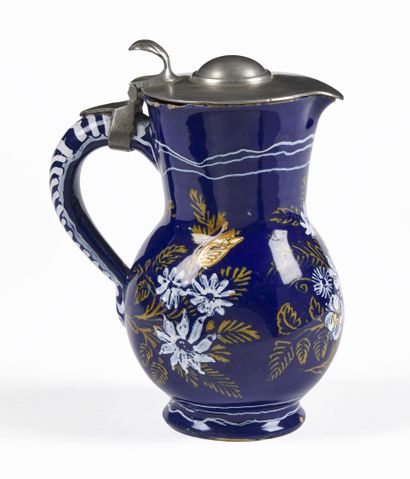 null NEVERS

Earthenware pitcher with white and orange decoration on a Persian blue...
