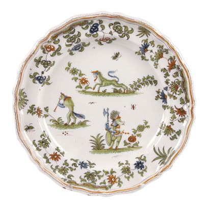 null MOUSTIERS

Earthenware plate with polychrome decoration of grotesque figures...