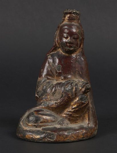 null CHINA - MING period (1368 - 1644)

A red lacquered bronze guanyin statuette...