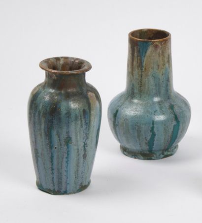null SCHOOL OF CARRIES

Two stoneware vases, one with a tubular body on a spherical...