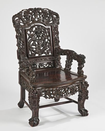 null VIETNAM - Circa 1900

Wooden armchair with openwork decoration of dragons chasing...