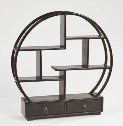 null CHINA - 20th century

A small natural wood display cabinet, round in shape,...