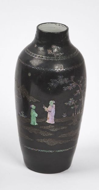 null CHINA - 19th century

A black lacquered porcelain baluster vase with a narrow...