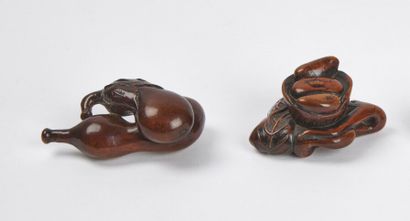 null JAPAN - 19th century

Two large wooden netsuke, one representing an eggplant...