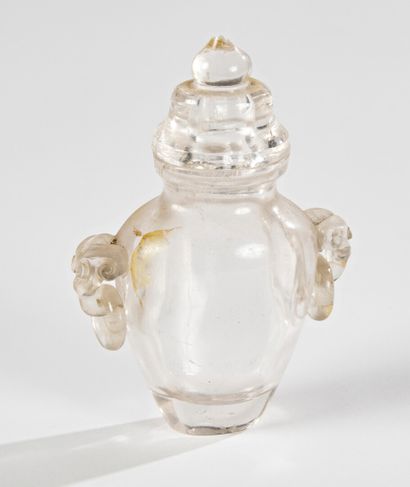 null CHINA - 19th century

A rock crystal miniature covered vase, the handles showing...