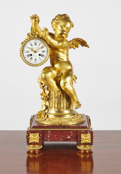 null Large clock with Love, the winged child holding the dial suspended from a ribbon...