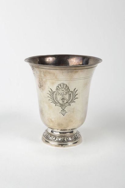 null A plain silver tulip tipple standing on a pedestal underlined by a moulding...
