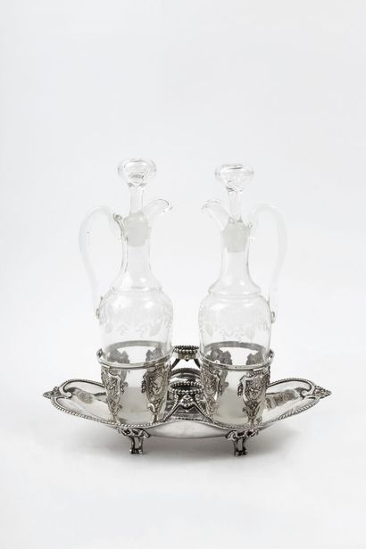 null A four-legged oil cruet stand with a moulding of pearls and pampers, the openwork...