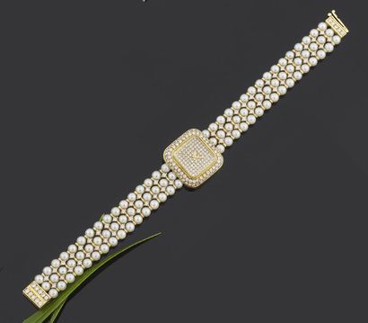 null MONTRE bracelet de dame, la montre de forme carrée en or jaune 750 millièmes...