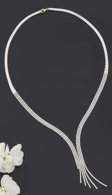 null NECKLACE articulated in white gold 585 thousandths, the center paved with white...