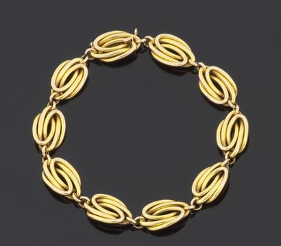 null BRACELET articulated in yellow gold 750 thousandths, the links with decoration...