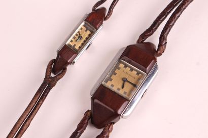 null TWO ladies' wristwatches, the watches in metal and wood, braided leather strap....