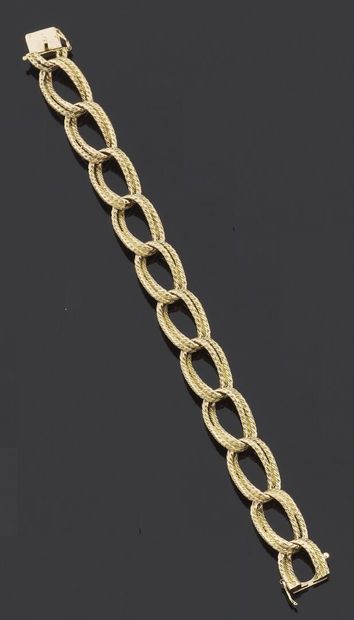 null BRACELET articulated in yellow gold 750 thousandths, the links of oval form...