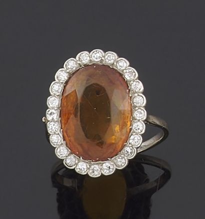 null RING in white gold 750 thousandths decorated in the center of a citrine of oval...