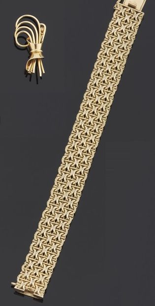 null BROCHE en or jaune 750 millièmes à décor de noeud stylisé. 

Hauteur : 3,5 cm

Poids...