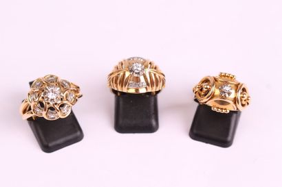 null THREE RINGS in yellow gold 750 thousandth and/or platinum, each one decorated...