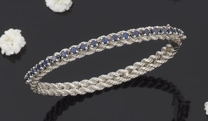 null BRACELET rigid opening in white gold 750 thousandth, decorated with two twists,...