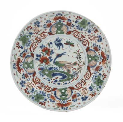null DELFT

Earthenware plate with blue, green and red decoration in the center of...