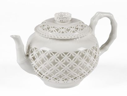 null SÈVRES

Round covered teapot in white enamelled porcelain with reticulated decoration,...
