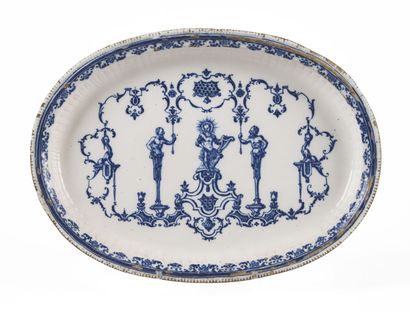 null MOUSTIERS

Oval earthenware basin decorated in blue monochrome in the center...