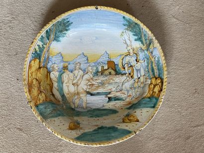 null DERUTA

Round earthenware dish with polychrome decoration of Diana and Actaeon....