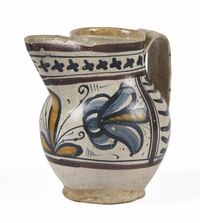 null ITALY

Earthenware pitcher with blue, orange and manganese decoration of stylized...