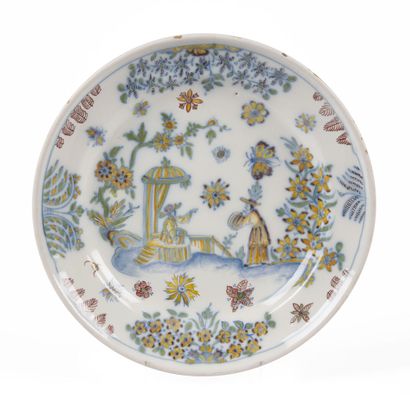 null MARSEILLE

Two earthenware plates with polychrome decoration of Chinese on flowered...
