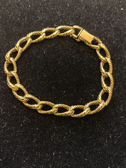 null Bracelet articulé en or jaune 750 millièmes, les maillons de forme ovale gravés...