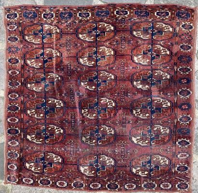 null Set of three carpets, one decorated with a central medallion on a red background...