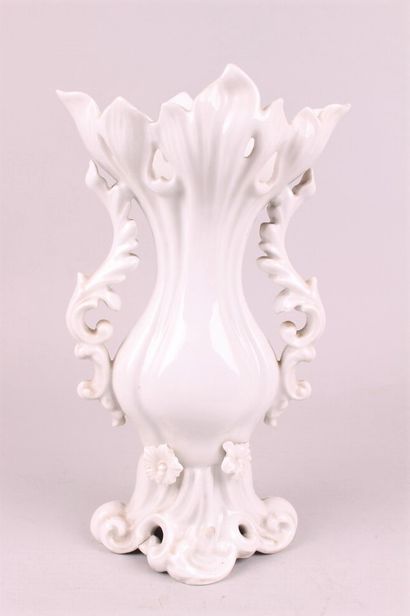 null PARIS 

A white enamelled porcelain bridal vase decorated with flowers in relief,...