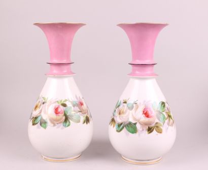 null PARIS, 19th century 

Pair of porcelain vases with polychrome flowers on a pink...