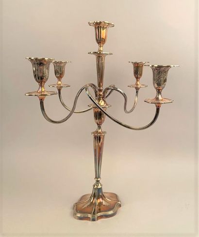 null A four-branched, five-light candelabra in plain silver plated metal, the base...