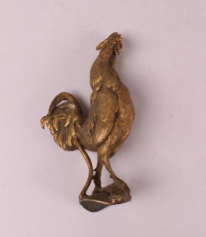  ENSEMBLE de petits sujets en bronze et cuivre comprenant : 
- un coq en bronze doré....