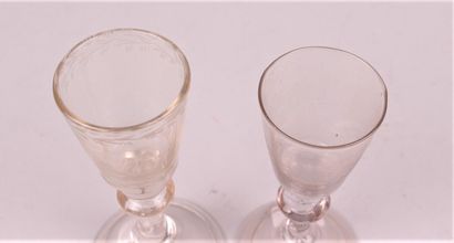 null TWO translucent blown glass leg glasses, one engraved. 

Height 11 and 12 cm...