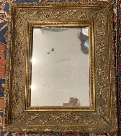 null Wood and gilded stucco rectangular mirror decorated with foliage, pearls and...