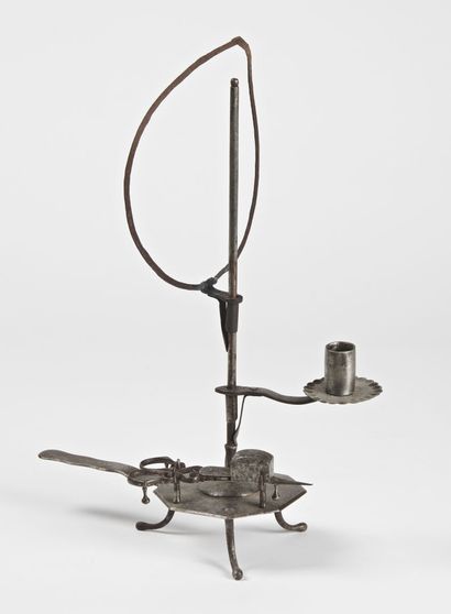 null Hand candlestick with adjustable screen in wrought iron with chiselled decoration...