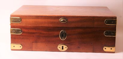 null A mahogany navy chest with two side handles and brass fittings, opening on an...