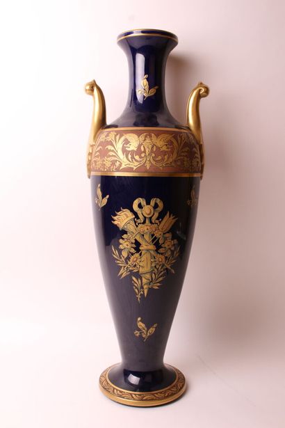 null A large porcelain baluster vase with two handles, decorated with a trophy and...