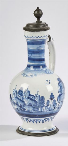 null Hanau

Earthenware pitcher with blue monochrome decoration of a village framed...